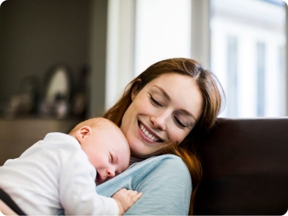 woman holding infant life insurance