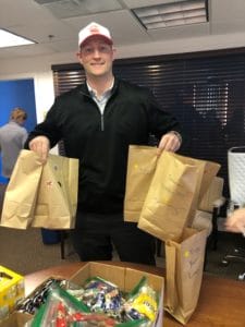 Sales Executive Kyle Carrigan helps out packing lunches