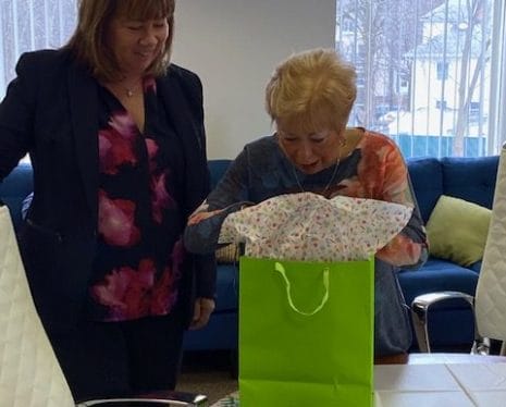 Sandi Cohen receives her retirement gift from President, Mary Lou Ricci