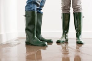 couple standing in flooded house